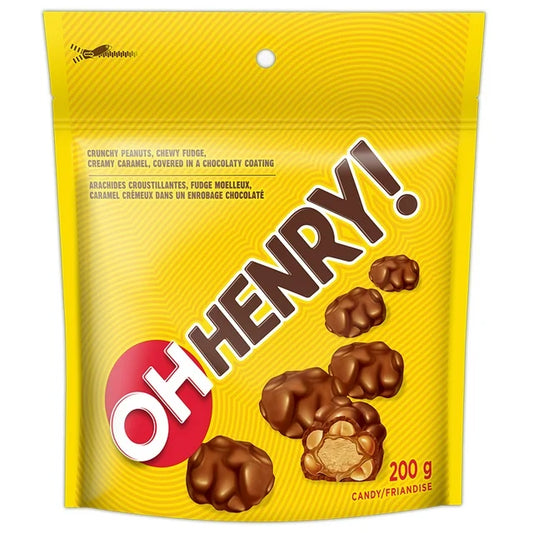 Yellow packaging of Oh Henry! candy with chocolate candies on a white background