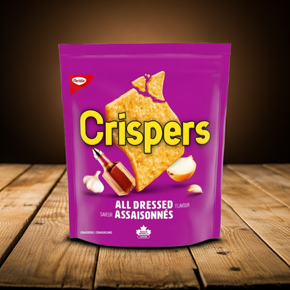 Purple package of Crispers All Dressed flavor on a wooden surface with a dark background